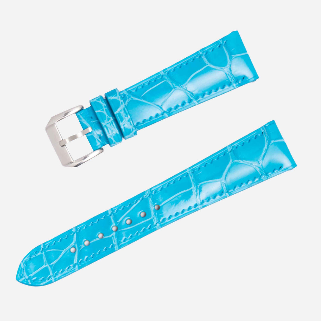 Blue watch strap with silver buckle on a white background