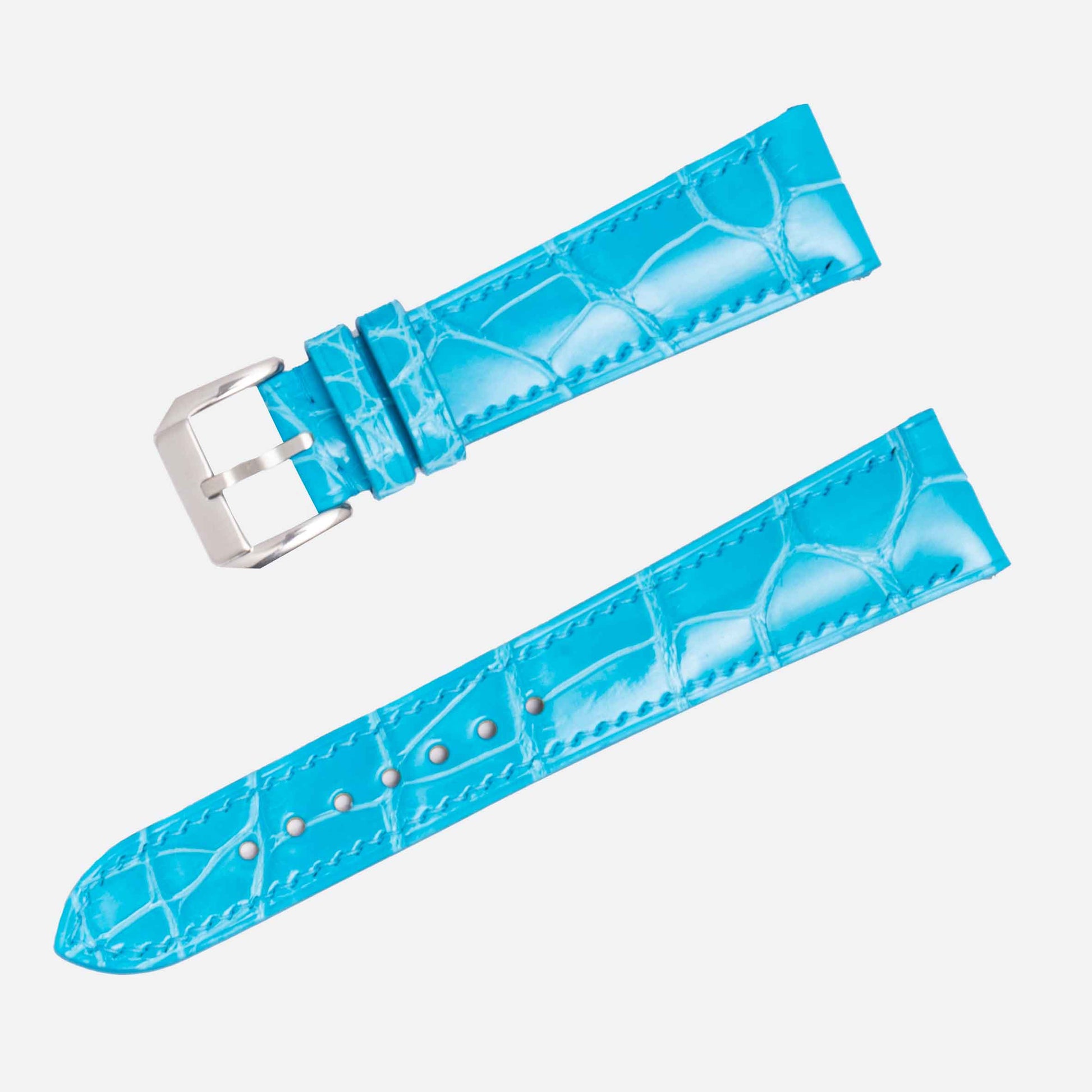 Blue watch strap with silver buckle on a white background